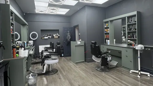 Inside Scissor Cut: the chairs and grey walls